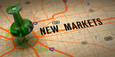 Image showing New Markets - Green Pushpin on a Map Background.