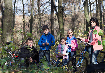 Image showing Family portrait with bicycles outdoors