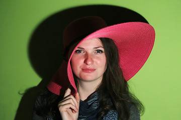 Image showing Cute brunette with pink hat