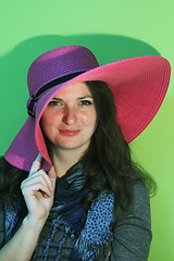 Image showing Brunette with pink hat