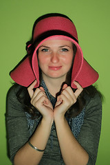 Image showing Pretty brunette with pinky hat