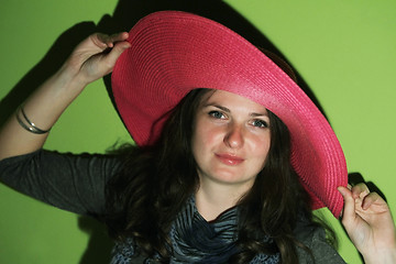 Image showing Brunette with pinky hat