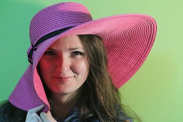 Image showing Lovely brunette with pink hat