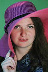 Image showing Charming brunette with pink hat