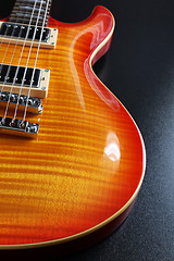 Image showing Cherry sunburst electric guitar