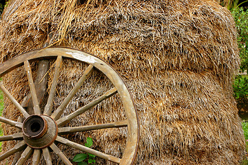 Image showing wheel-cart with stack of straw