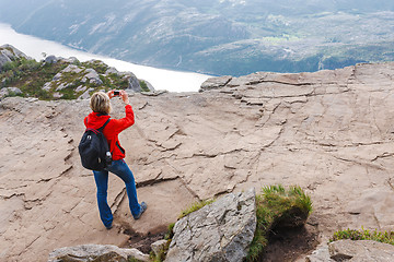 Image showing Woman hiker on Pulpit Rock / Preikestolen, Norway