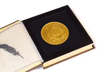 Image showing Medal with the image of the book and a laurel branch on a white 