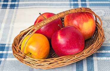 Image showing Large apples in a wattled basket.