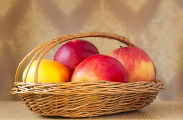 Image showing Large apples in a wattled basket.