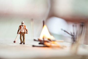 Image showing Miniature people in action with matchsticks