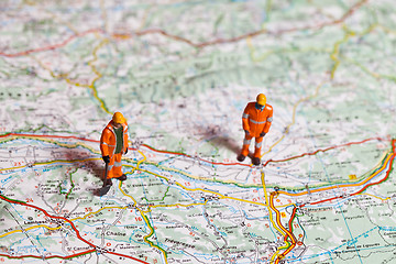 Image showing Miniature people in action on a roadmap