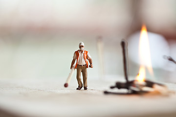 Image showing Miniature people in action with matchsticks