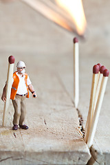 Image showing Miniature people in action with matchsticks