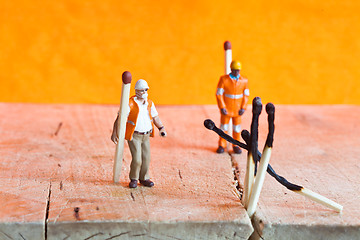 Image showing Miniature people in action with matchsticks