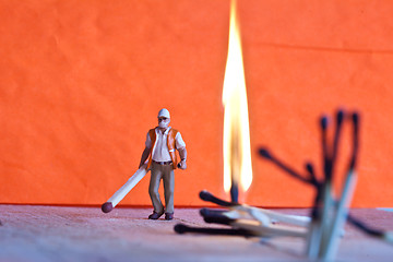 Image showing Miniature people in action with matchsticks
