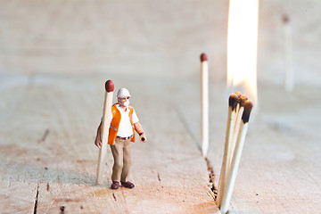 Image showing Miniature people in action with matchsticks