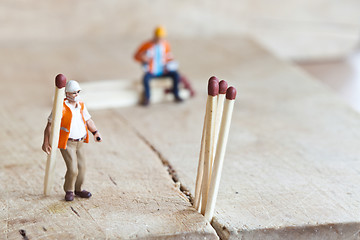 Image showing Miniature people in action with matchsticks