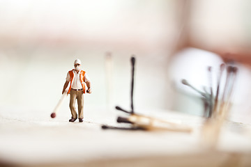 Image showing Miniature people in action with matchsticks