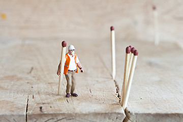 Image showing Miniature people in action with matchsticks