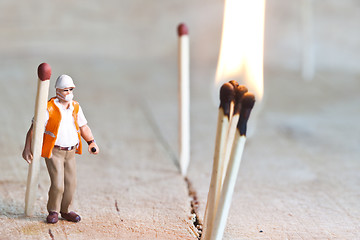 Image showing Miniature people in action with matchsticks