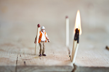 Image showing Miniature people in action with matchsticks