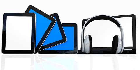 Image showing headphones on the  laptop and  tablet pc