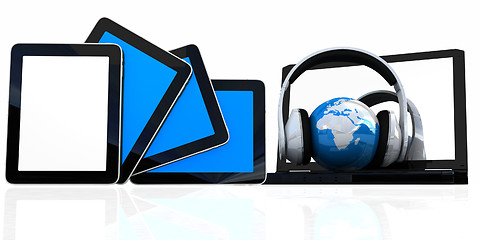 Image showing headphones and  earth on the  laptop and tablet pc