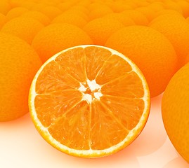 Image showing half oranges and oranges