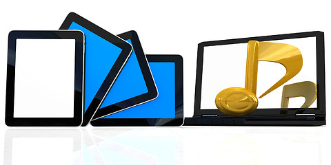 Image showing yellow note on the  laptop and  tablet pc