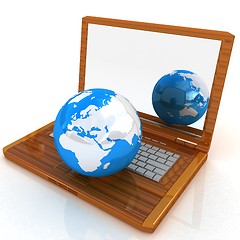 Image showing Eco Wooden Laptop and Earth