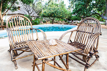 Image showing Chairs on swimming pool border