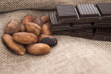 Image showing Cocoa (cacao) beans with chocolate