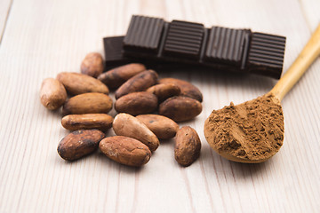 Image showing Cocoa (cacao) beans with chocolate