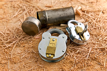 Image showing Two Metal Locks on top of Wooden Shavings
