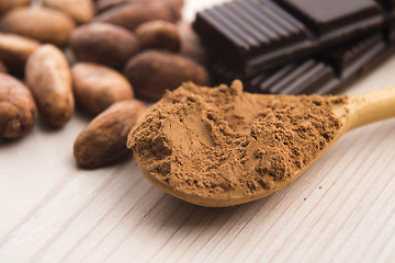 Image showing Cocoa (cacao) beans with chocolate