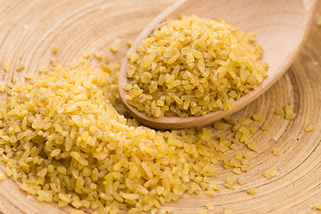 Image showing bulgur wheat in wooden spoon