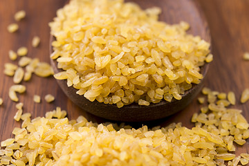 Image showing bulgur wheat in wooden spoon