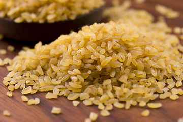 Image showing bulgur wheat in wooden spoon