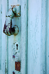 Image showing spain  hand brass knocker abstract door in the grey