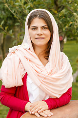 Image showing Beautiful middle eastern woman in pink scarf.