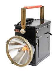 Image showing Old fashioned flashlight in on state