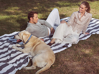 Image showing couple having rest with dog