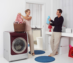 Image showing dooing  laundry with washing machine