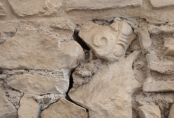 Image showing Ancient wall with a fragment of a column in it