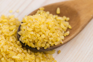 Image showing bulgur wheat in wooden spoon