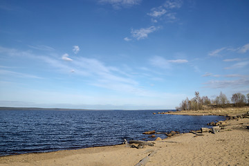 Image showing Sandy beach on lake in sunny spring day