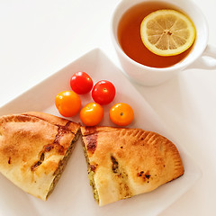 Image showing Empanada and a cup of tea