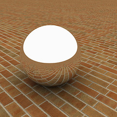 Image showing Chrome ball on the brick floor 