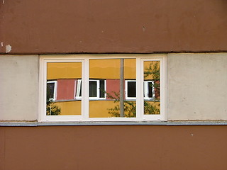 Image showing neighbour house mirroring from the clean window
